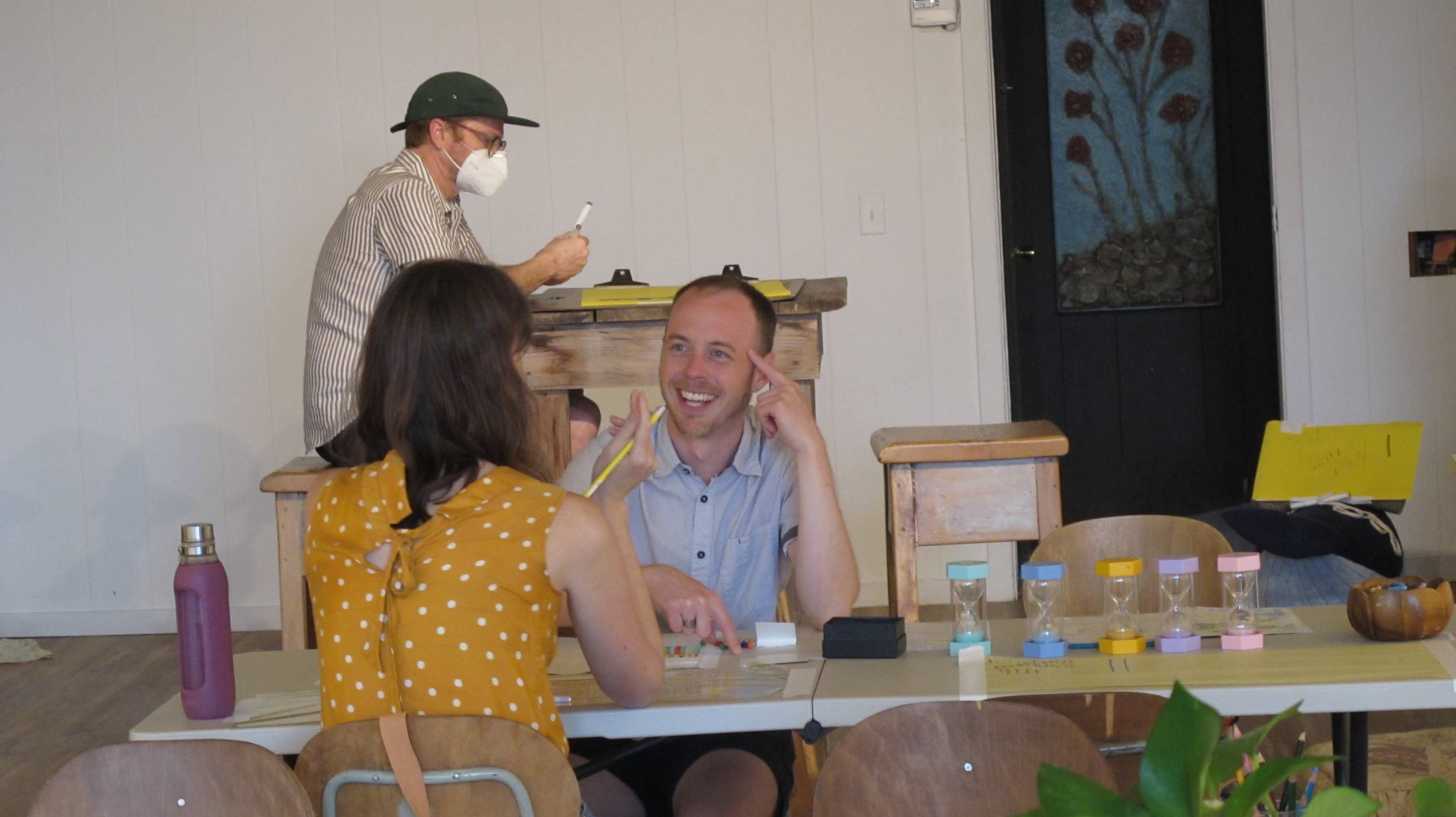 image of two friends making marks on paper